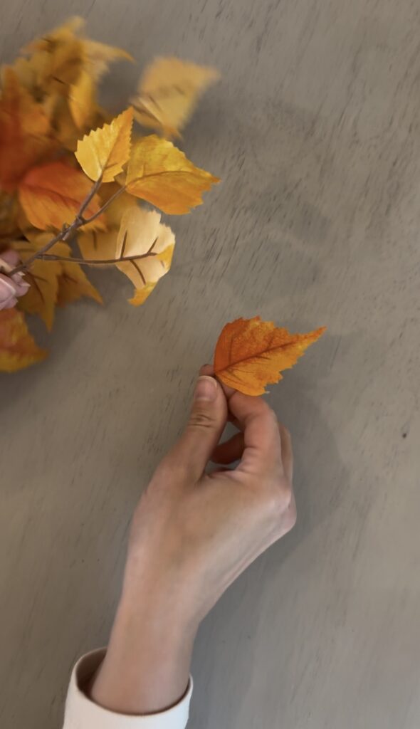 fall leaves from Michaels craft store to go on the stir and gather spooky Halloween mantel