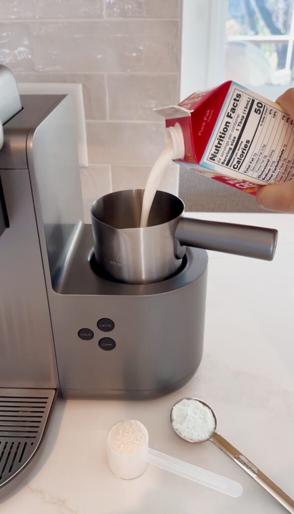 adding cream to a frother in the stir and gather kitchen
