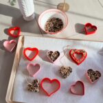 stir and gather making DIY heart shaped bird seed feeders
